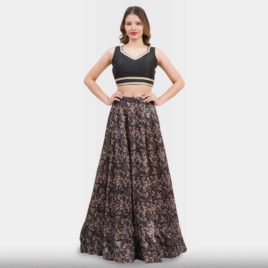 Woman wearing a black top and floral skirt on a white background